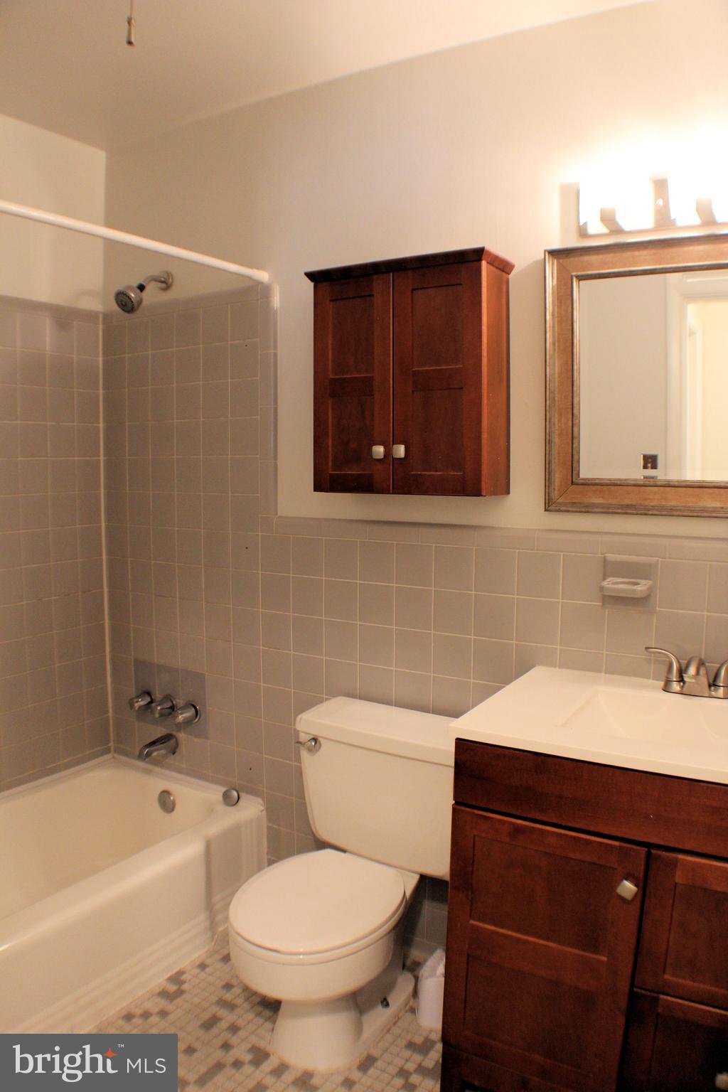 1 Center Road, Unit B4 Towson, MD 21286 - Photo 12 of 16 a bathroom with a sink toilet and shower
