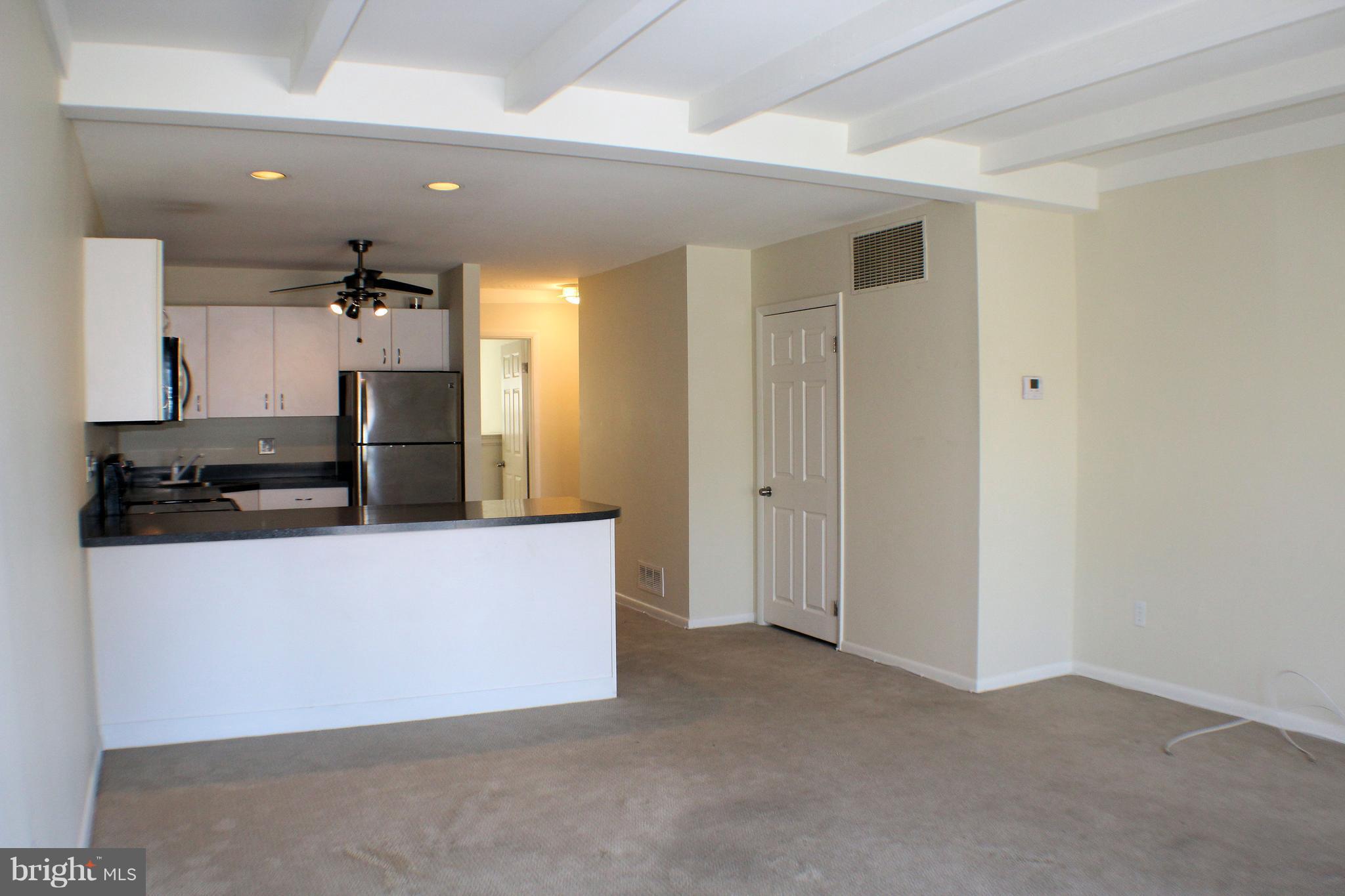 1 Center Road, Unit B4 Towson, MD 21286 - Photo 3 of 16 a view of kitchen with stainless steel appliances cabinets