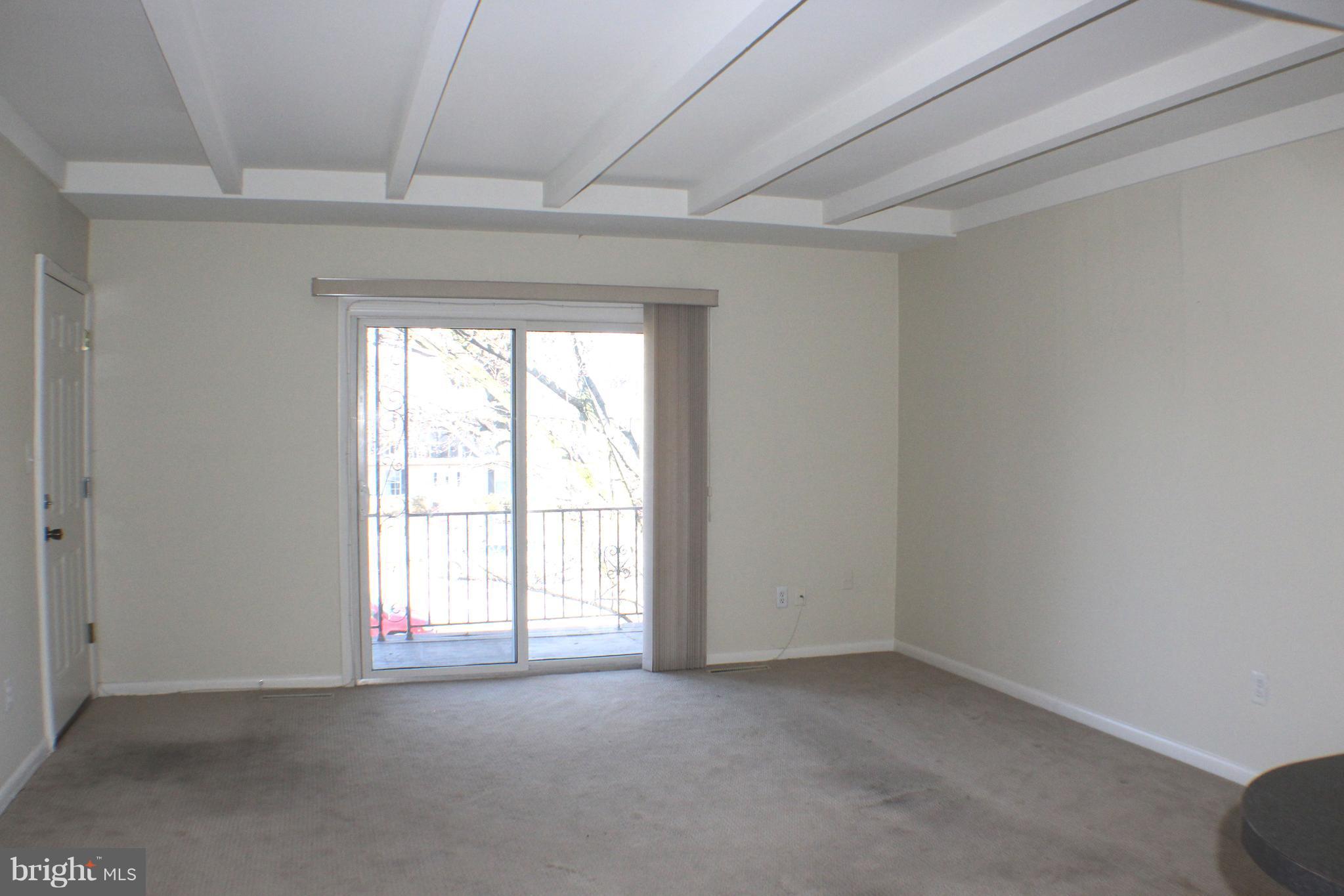 1 Center Road, Unit B4 Towson, MD 21286 - Photo 7 of 16 an empty room with a window