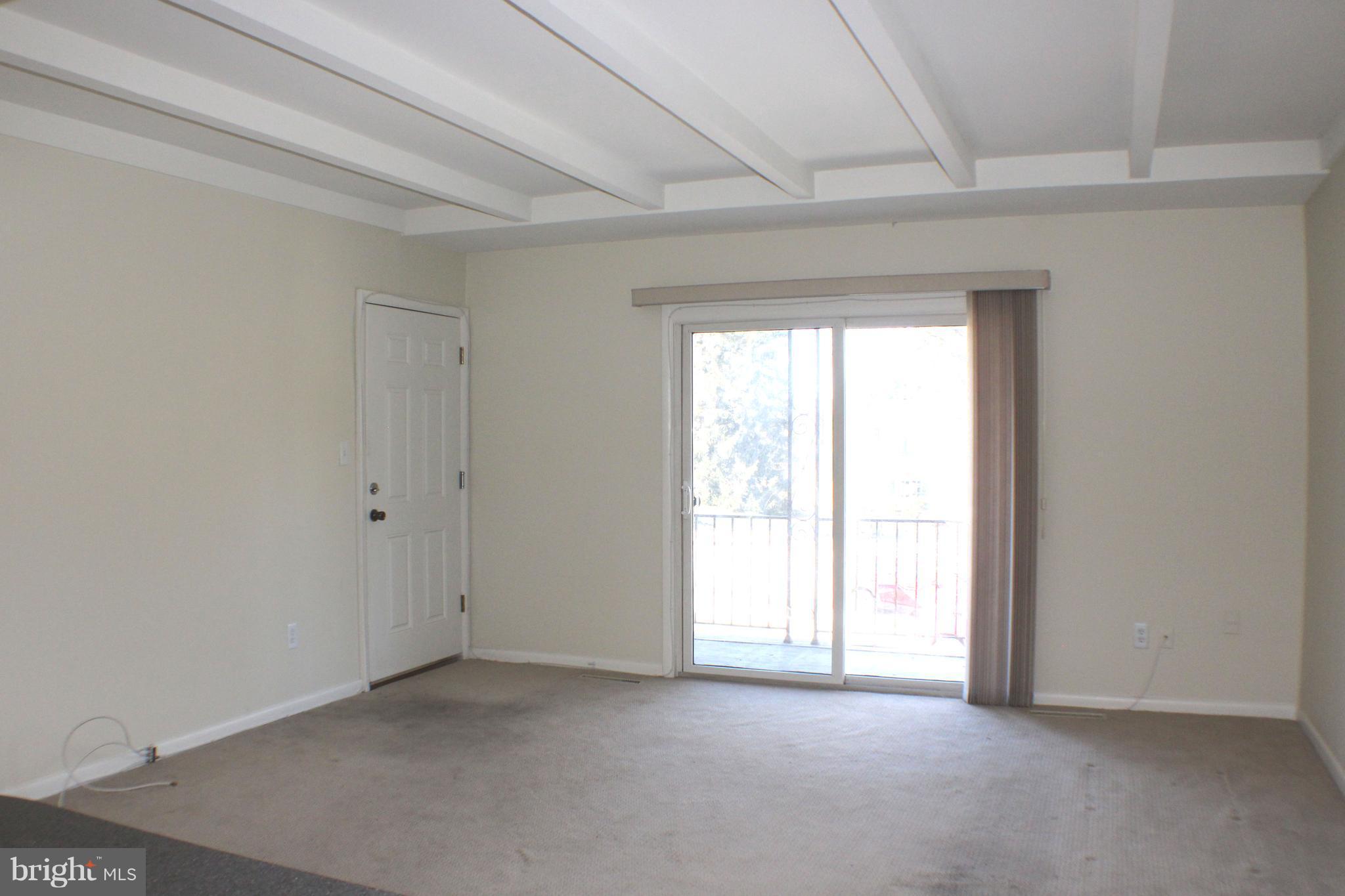 1 Center Road, Unit B4 Towson, MD 21286 - Photo 8 of 16 an empty room with windows