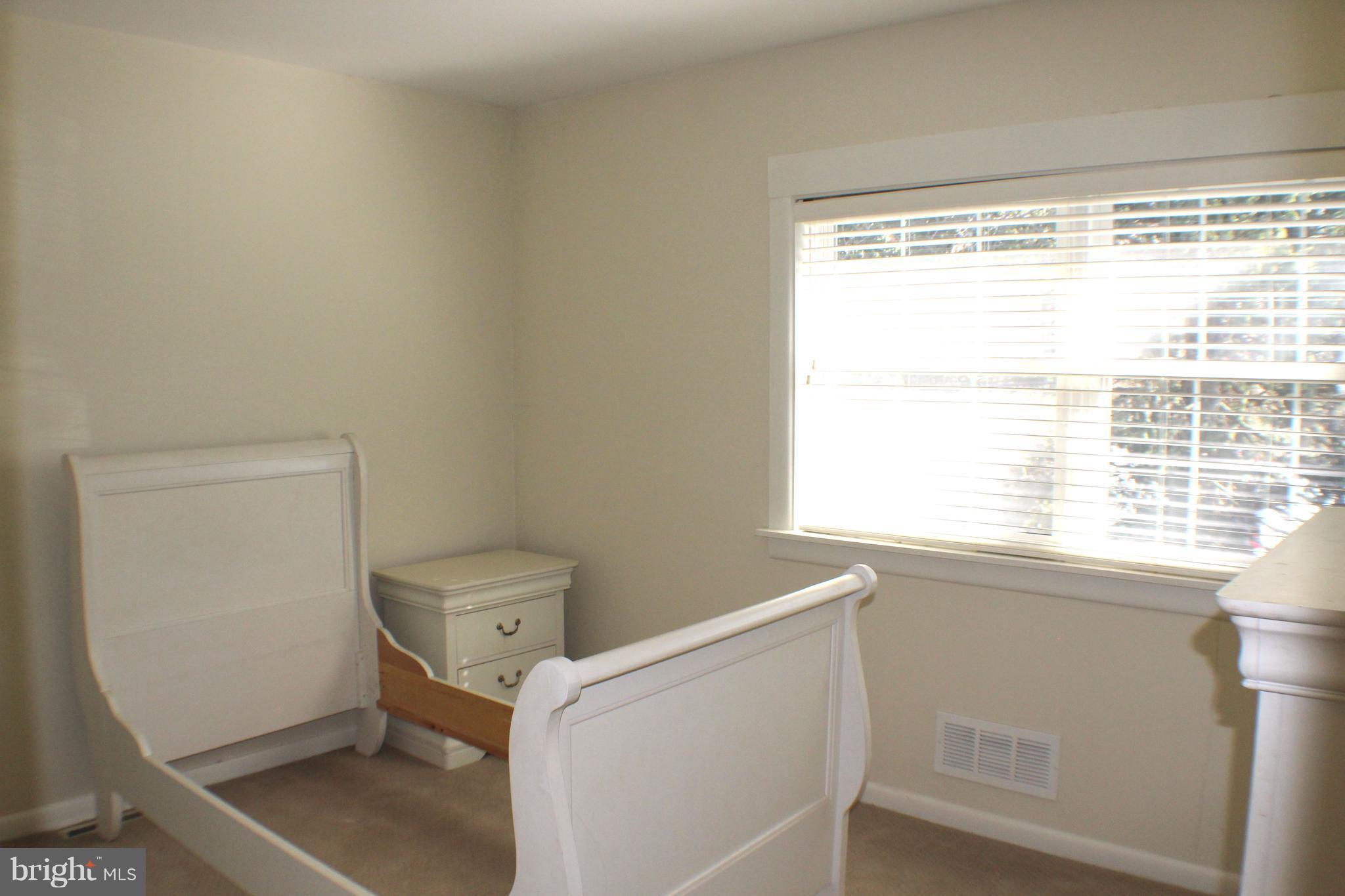 1 Center Road, Unit B4 Towson, MD 21286 - Photo 9 of 16 a bathroom with a window a toilet and a shower