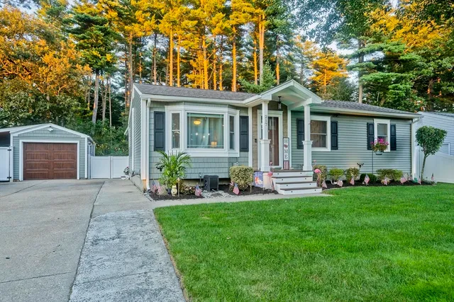 a front view of house with yard and green space