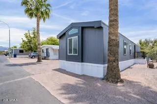 a view of a house with a yard and garage