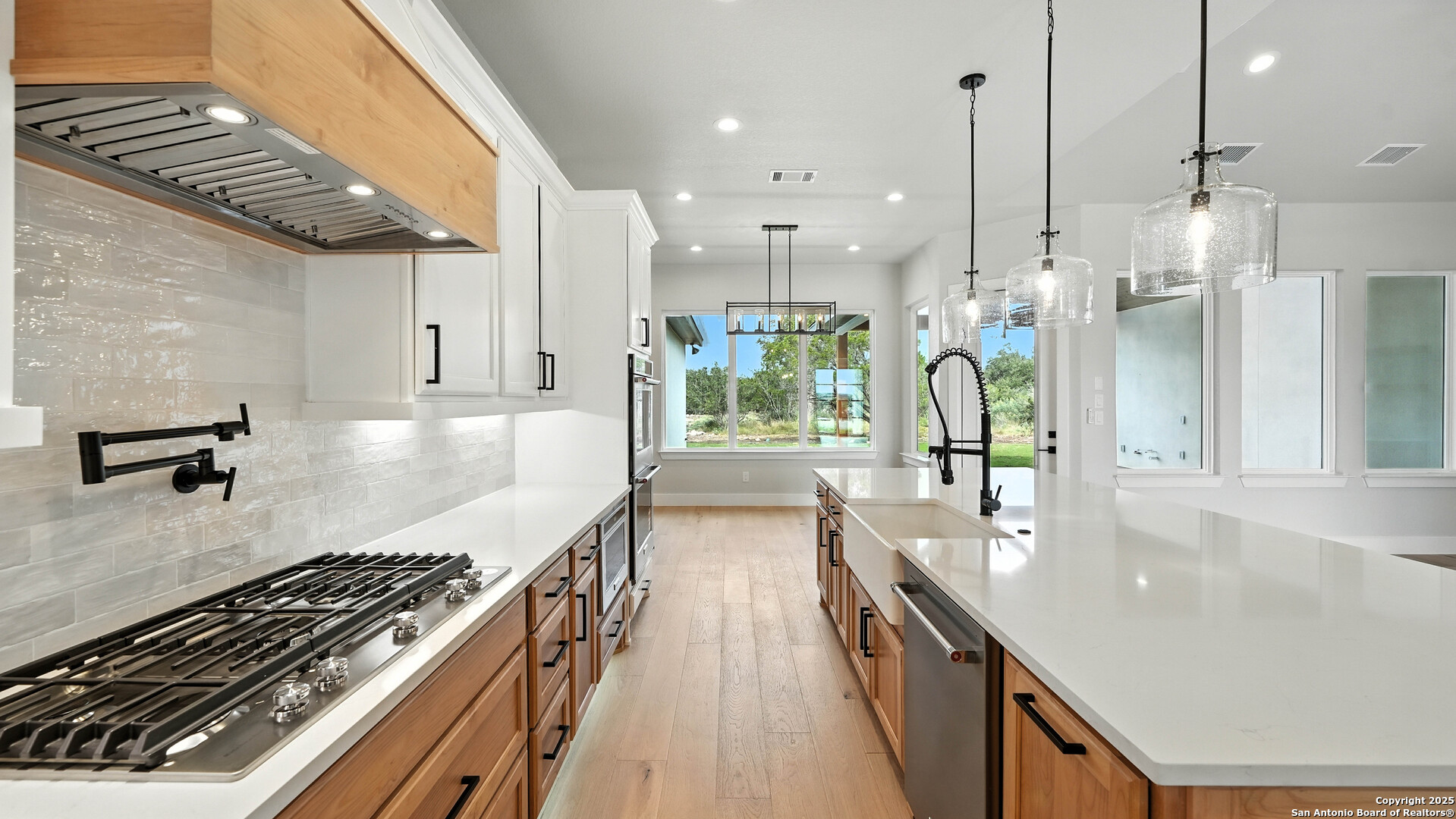 306 Toucan Drive Spring Branch, TX 78070 - Photo 1 of 50 a kitchen with stainless steel appliances granite countertop a sink stove and refrigerator