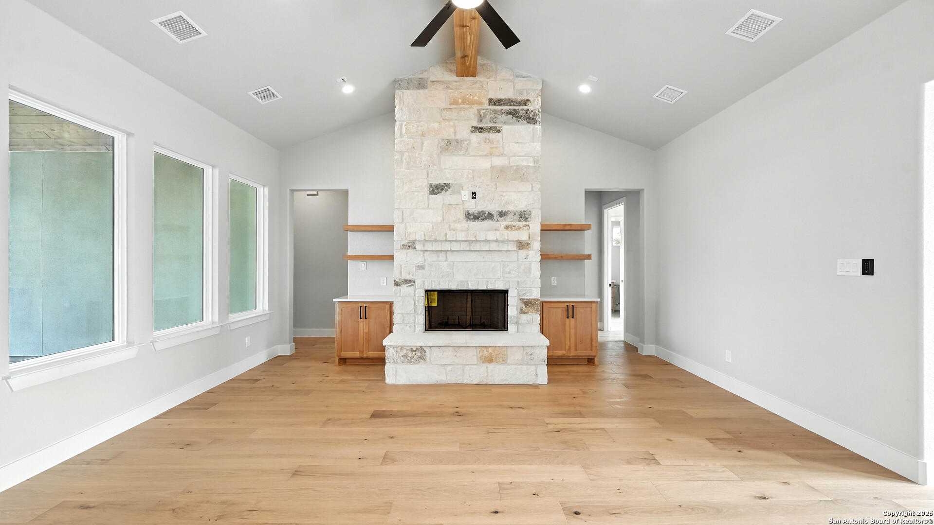 306 Toucan Drive Spring Branch, TX 78070 - Photo 14 of 50 a view of a living room kitchen with a fireplace