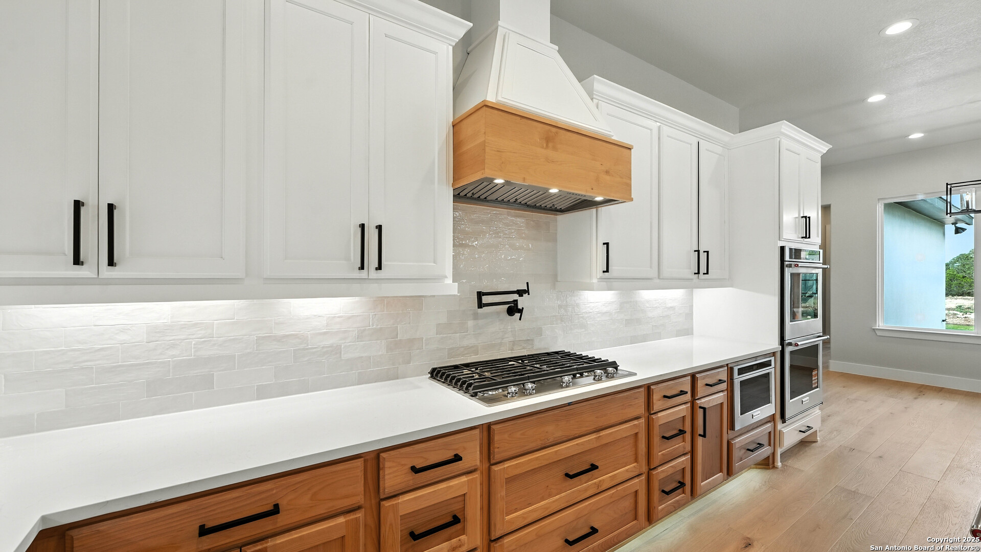 306 Toucan Drive Spring Branch, TX 78070 - Photo 19 of 50 a kitchen with cabinets and a stove top oven