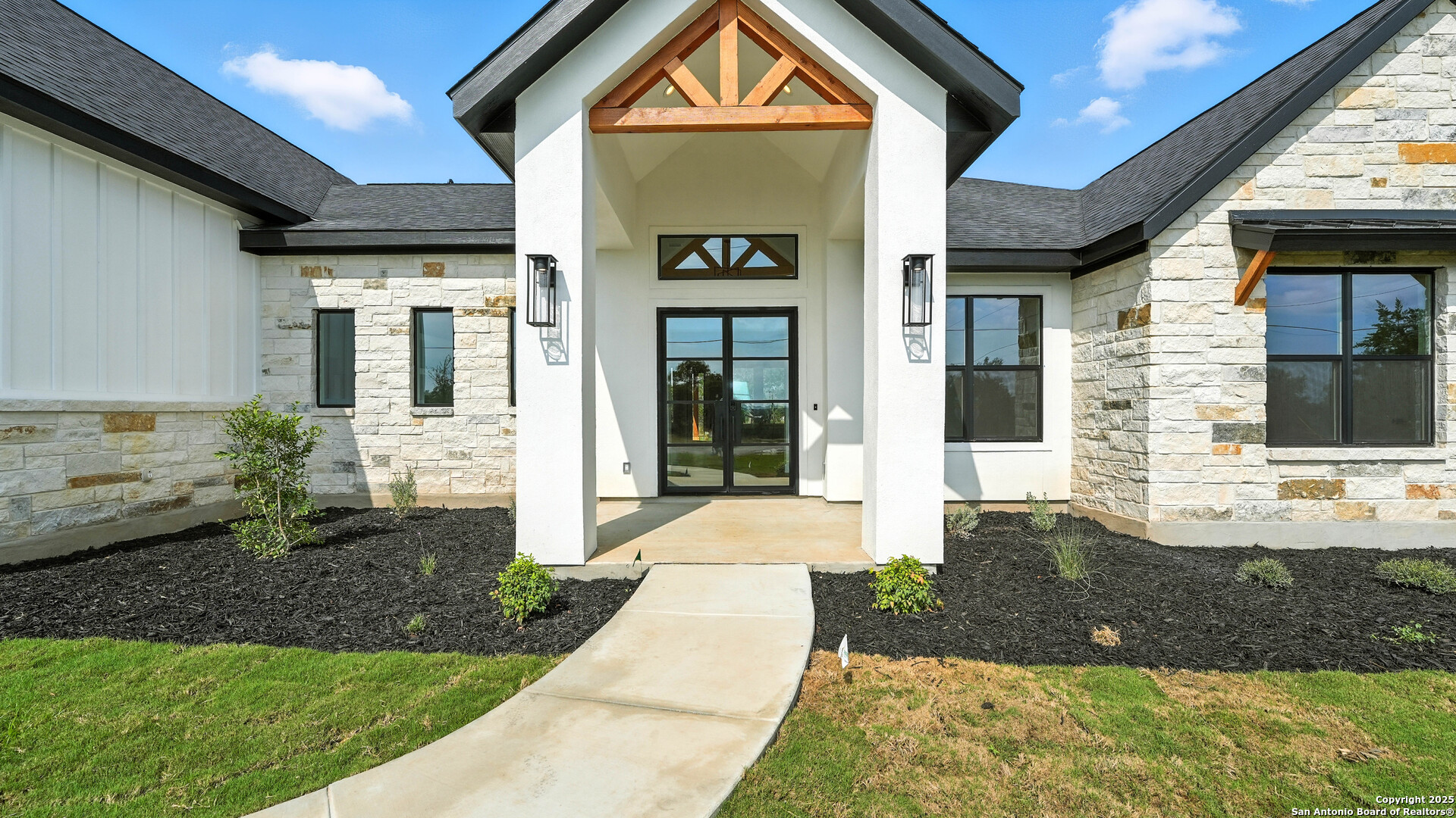 306 Toucan Drive Spring Branch, TX 78070 - Photo 2 of 50 a front view of a house with garden