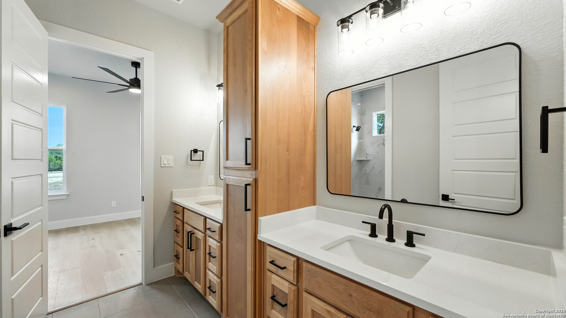 306 Toucan Drive Spring Branch, TX 78070 - Photo 28 of 50 a bathroom with a sink and a mirror
