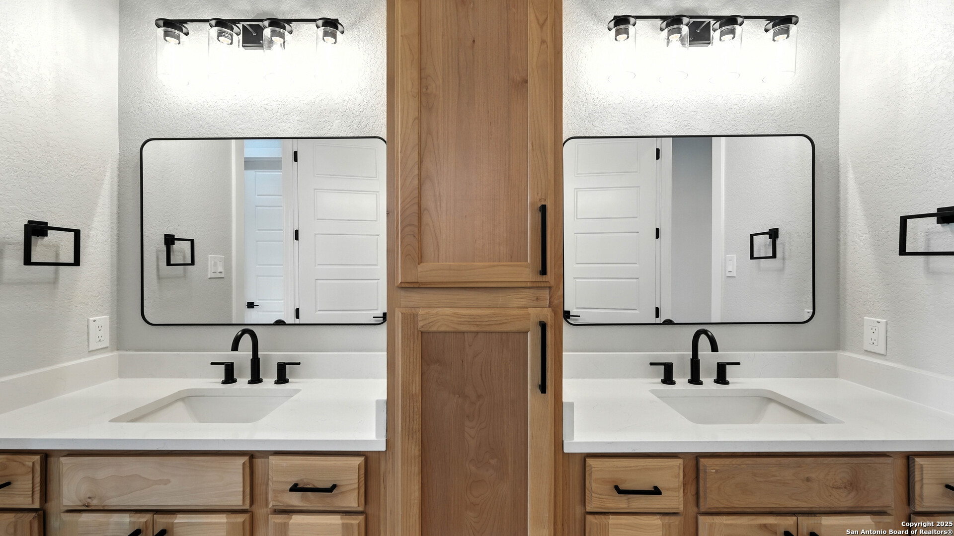 306 Toucan Drive Spring Branch, TX 78070 - Photo 29 of 50 a bathroom with a sink and a mirror