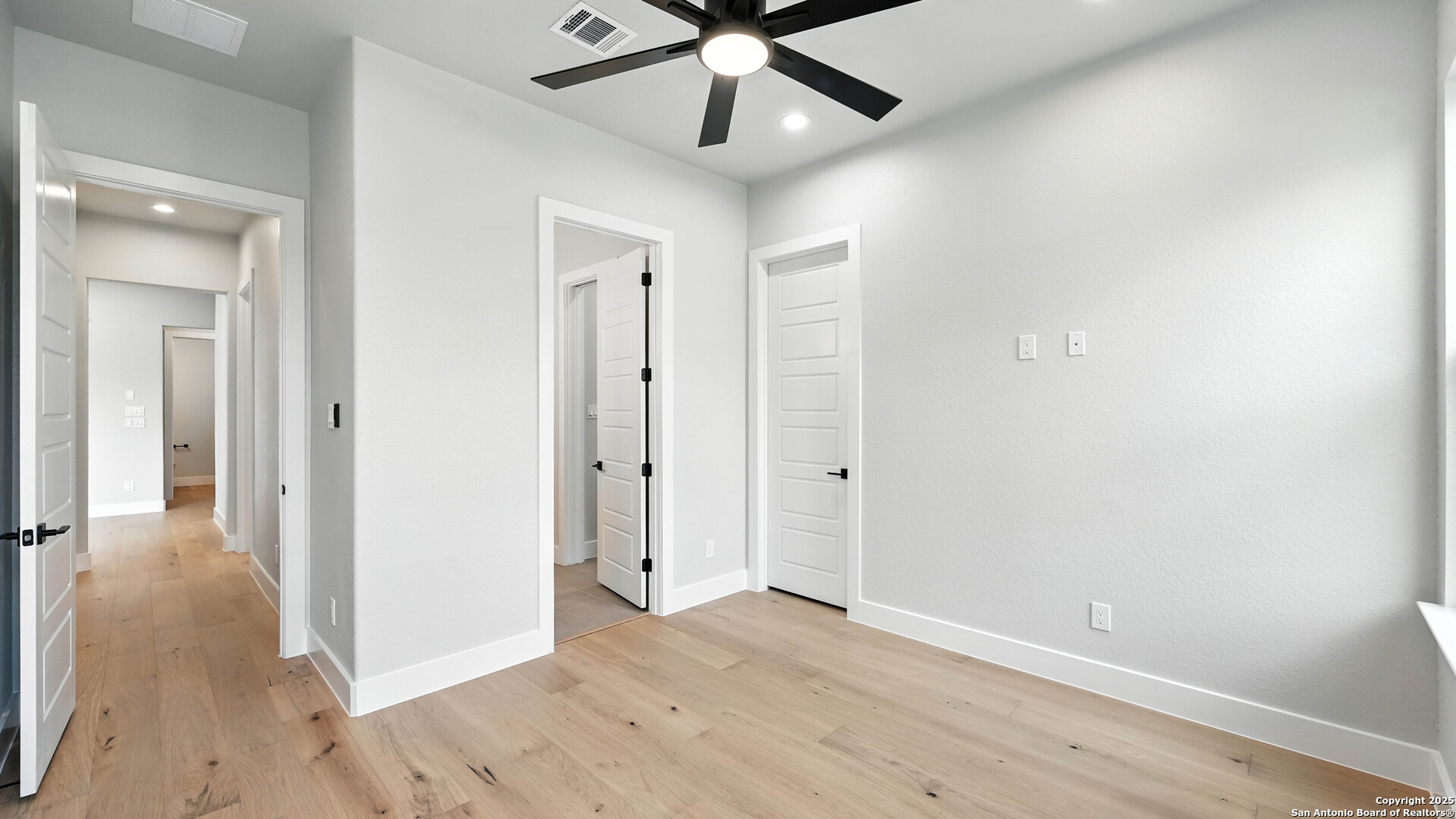 306 Toucan Drive Spring Branch, TX 78070 - Photo 32 of 50 wooden floor in an empty room with a window