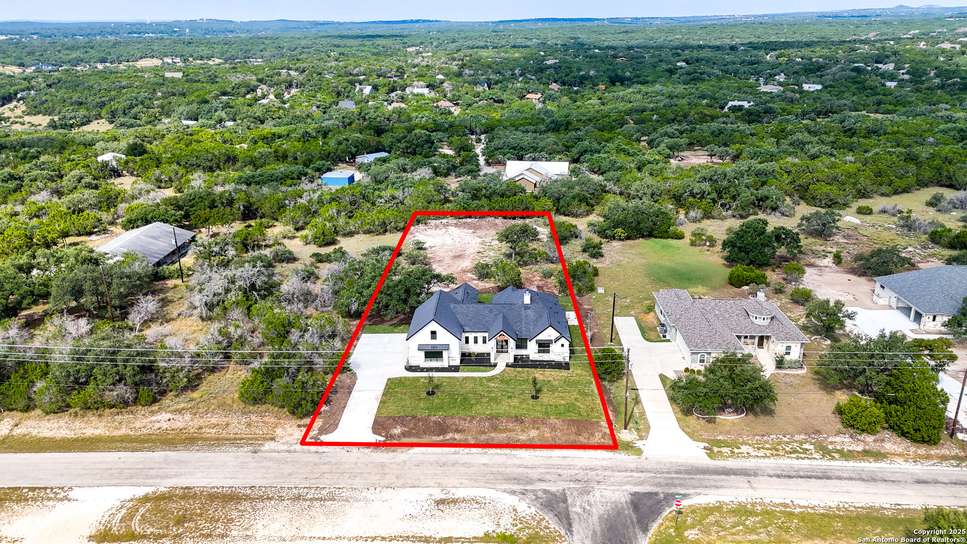 306 Toucan Drive Spring Branch, TX 78070 - Photo 48 of 50 an aerial view of residential houses with outdoor space and trees