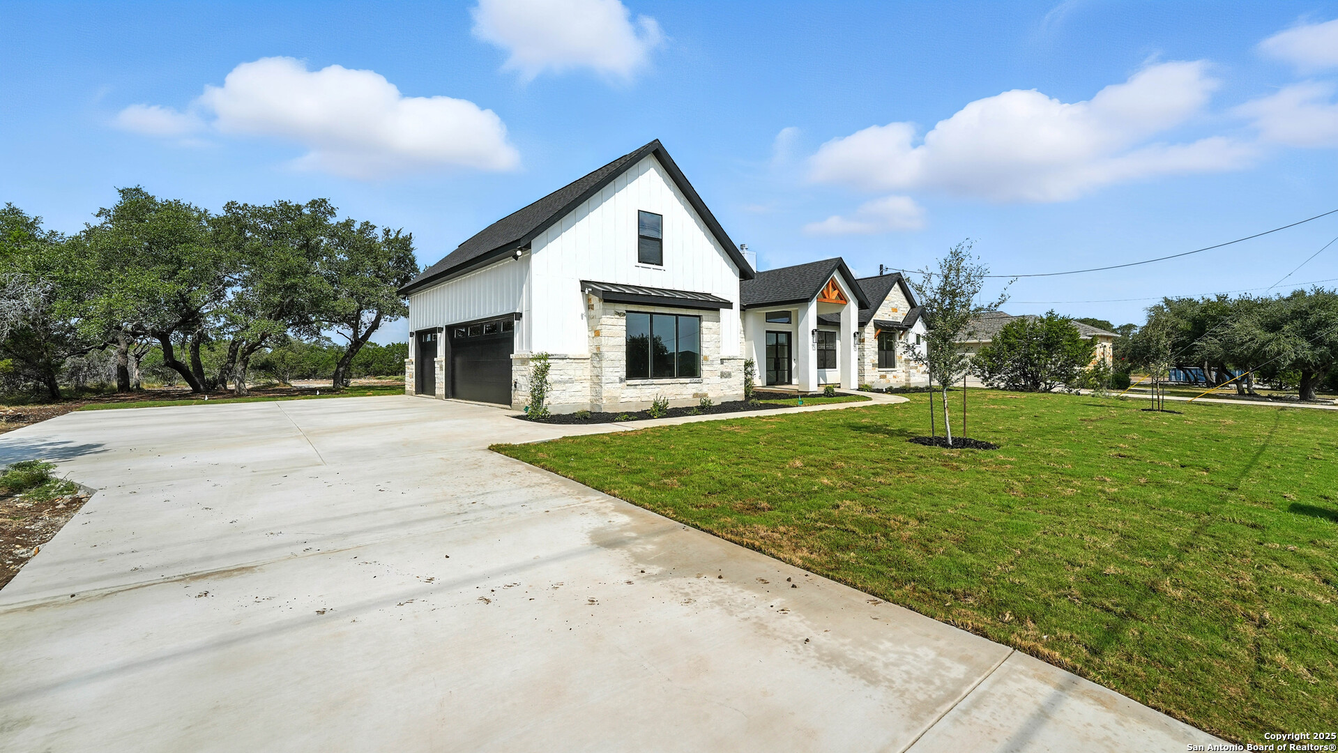 306 Toucan Drive Spring Branch, TX 78070 - Photo 5 of 50 a front view of a house with a yard and trees