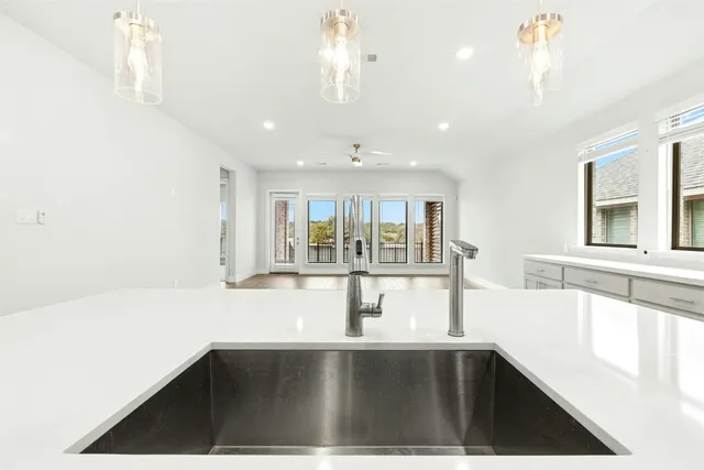 a kitchen with a sink and window