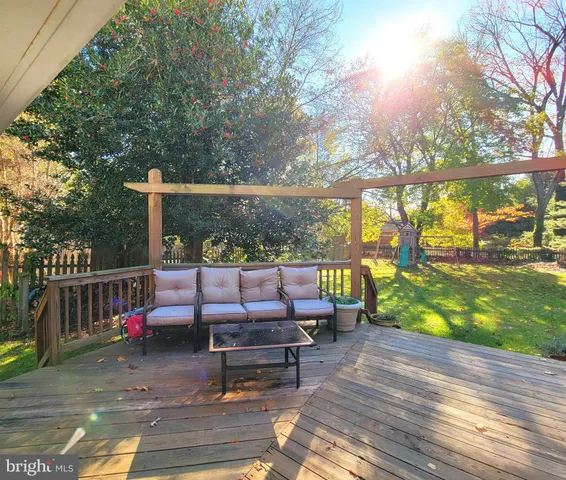 a bench sitting on top of a wooden floor