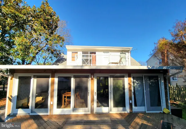 a view of a livingroom with furniture and a window