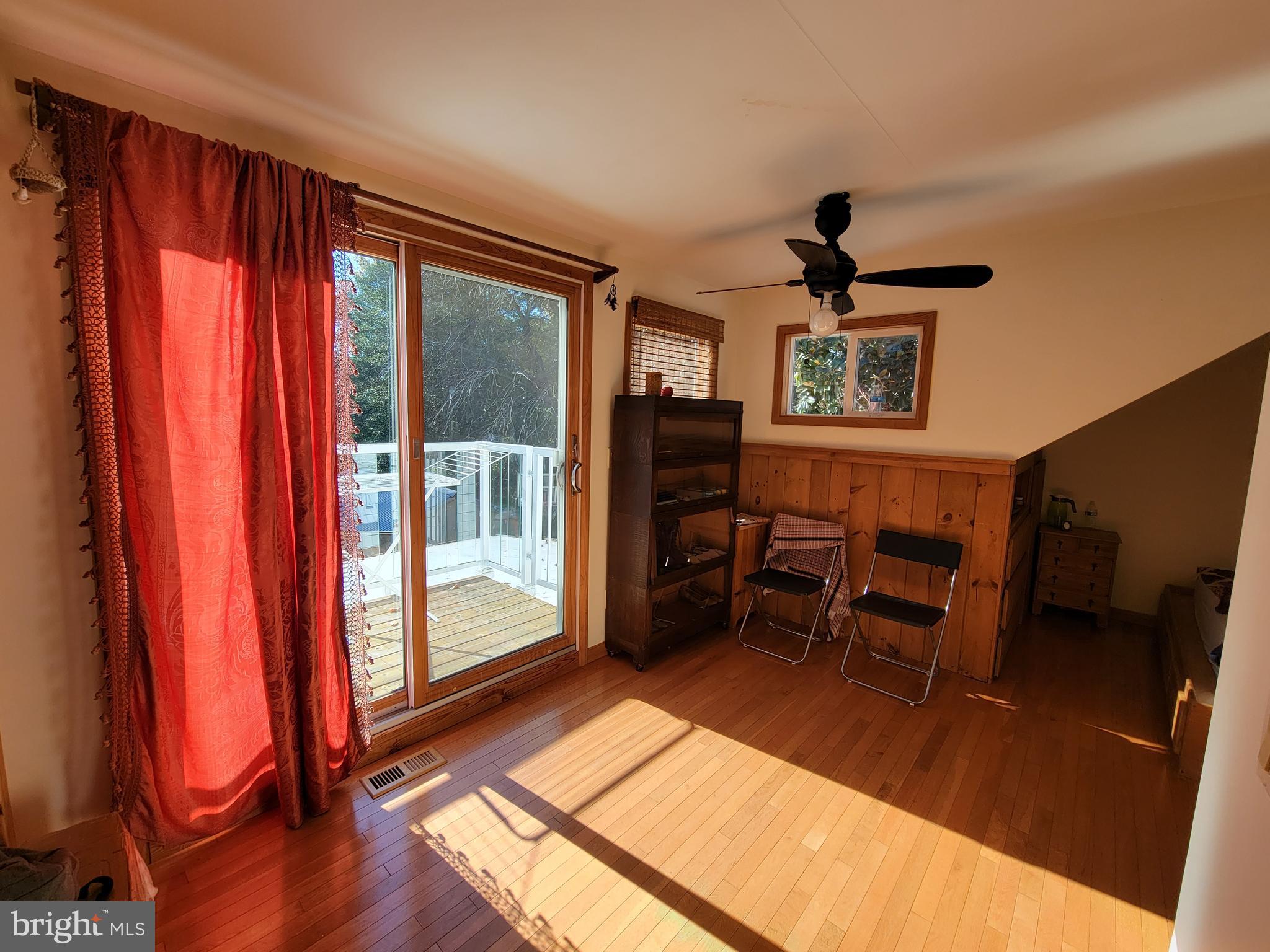 214 Villanova Road Glassboro, NJ 08028 - Photo 14 of 15 a view of a livingroom with furniture and a window