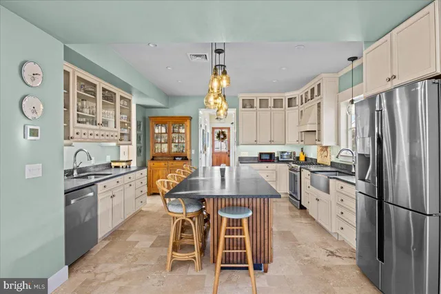 a living room with furniture a fireplace and a table