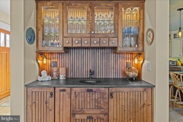 a living room with patio furniture and a window