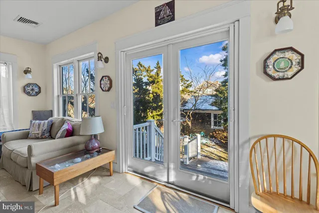 a view of a chair and table in backyard