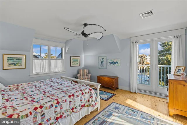 a bathroom with a toilet a sink and glass door