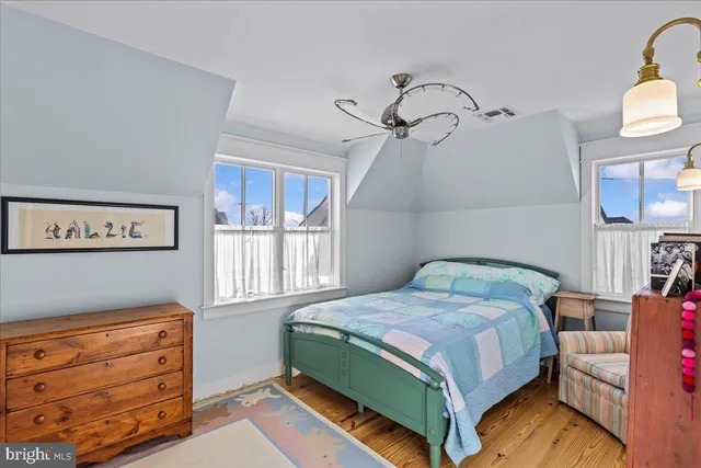 a living room with furniture flowerpot and a window