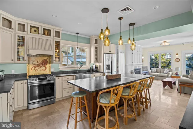 a kitchen with granite countertop a stove and cabinets