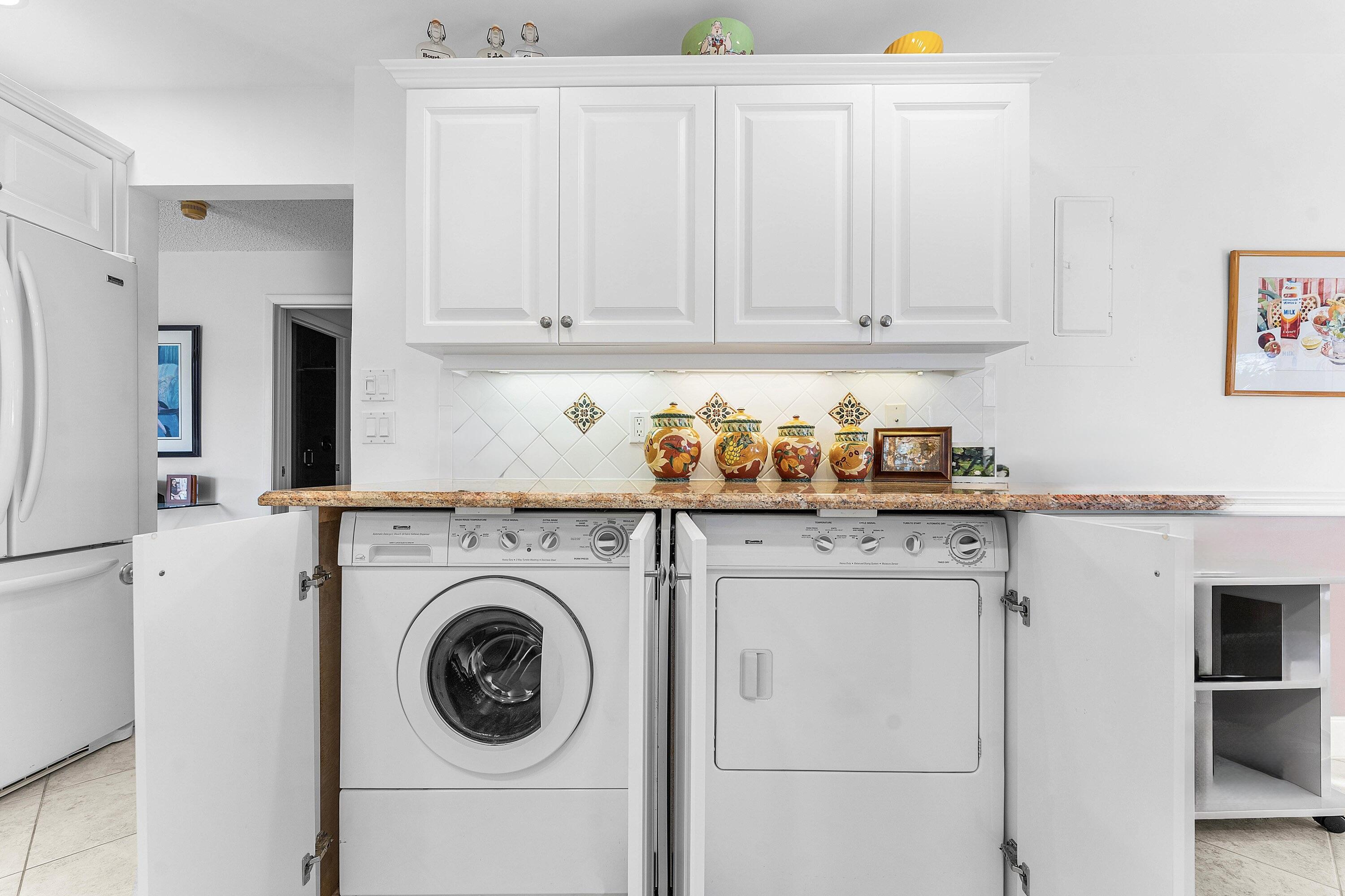 61 Eastgate Drive, Unit A Boynton Beach, FL 33436 - Photo 19 of 54 a utility room with dryer and washer