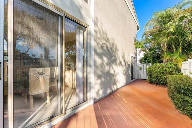 a room with lots of chairs and large windows