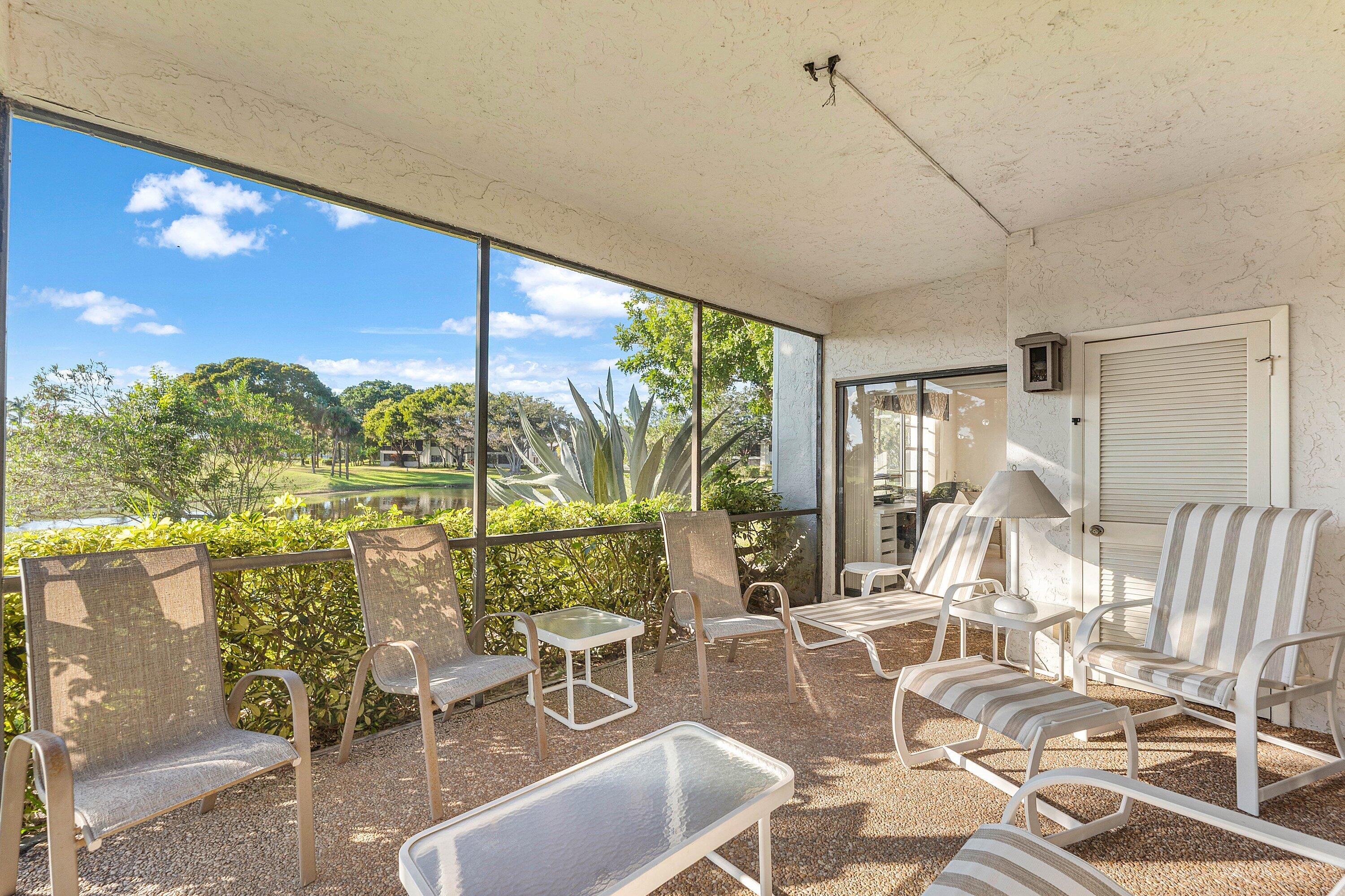 61 Eastgate Drive, Unit A Boynton Beach, FL 33436 - Photo 29 of 54 a room with lots of chairs and large windows