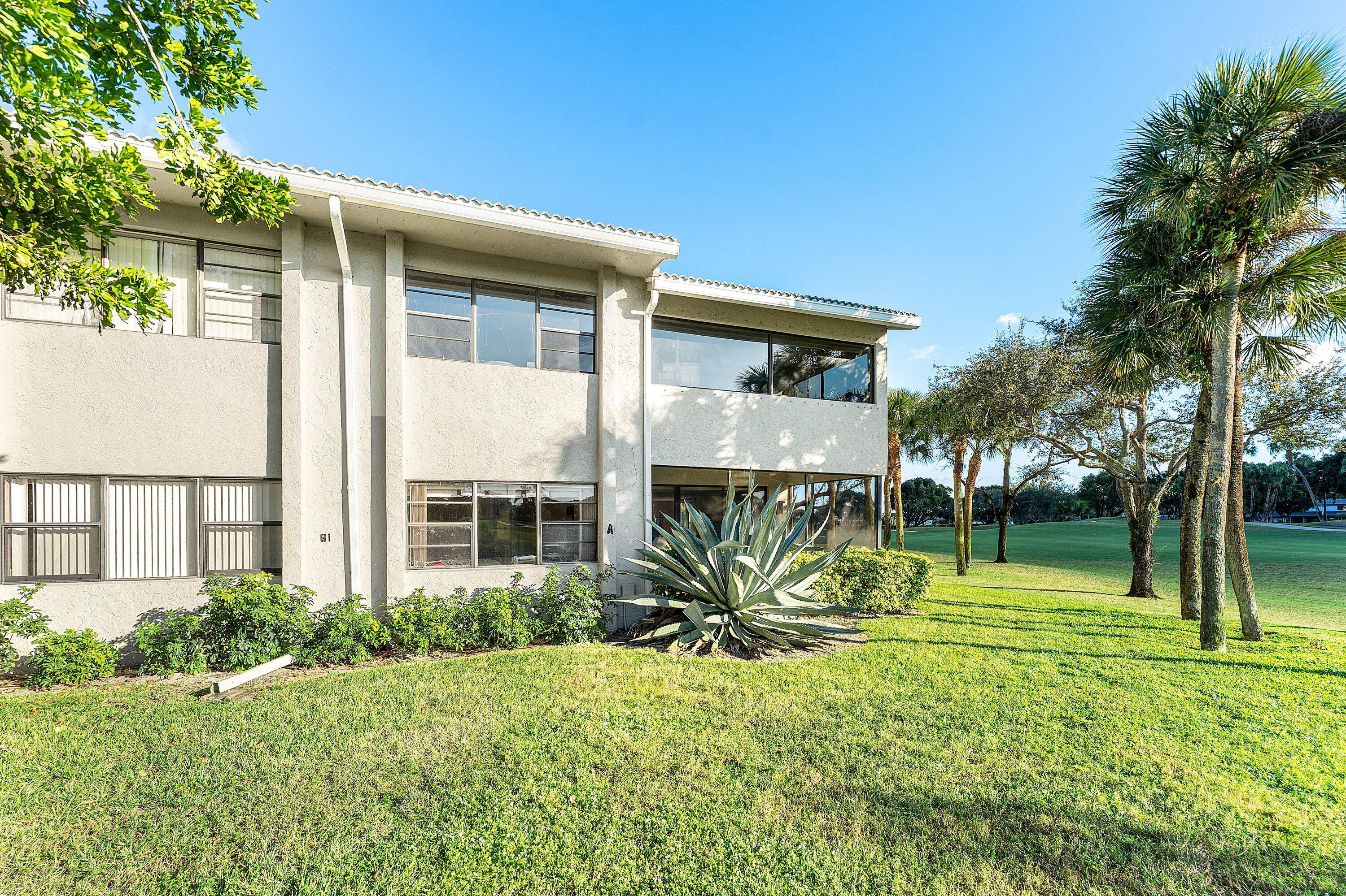 61 Eastgate Drive, Unit A Boynton Beach, FL 33436 - Photo 35 of 54 a view of a back yard of the house