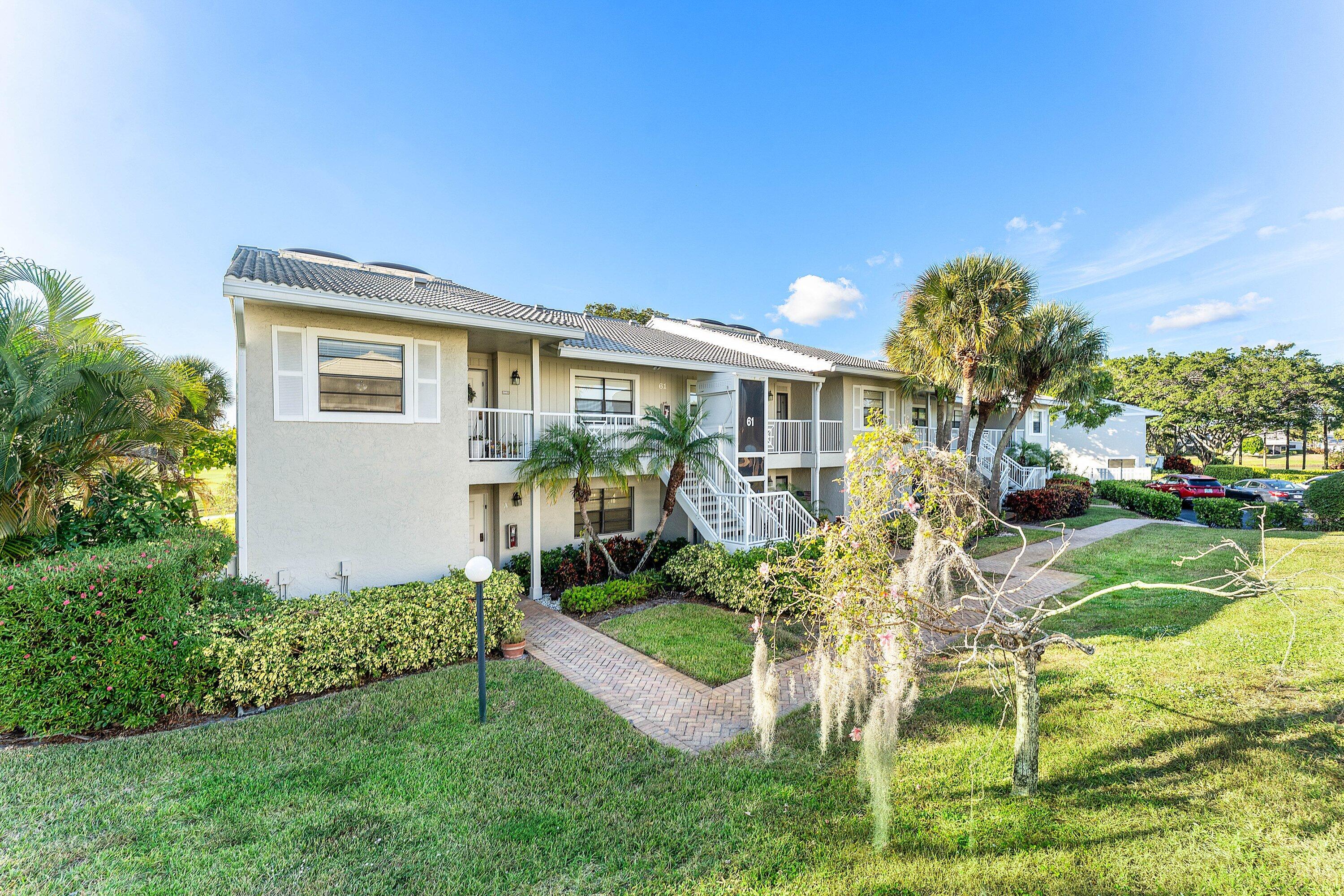61 Eastgate Drive, Unit A Boynton Beach, FL 33436 - Photo 4 of 54 a view of a house with a yard porch and sitting area