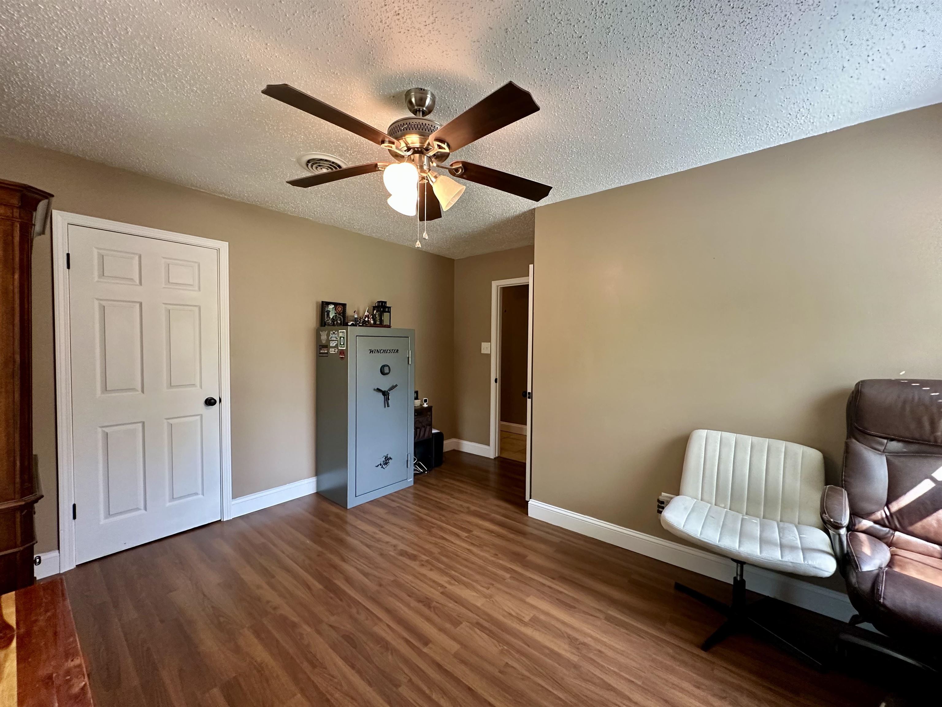 1230 Joann Road Somerville, TN 38068 - Photo 18 of 28 Sitting room with a textured ceiling, dark wood-style flooring, and a ceiling fan
