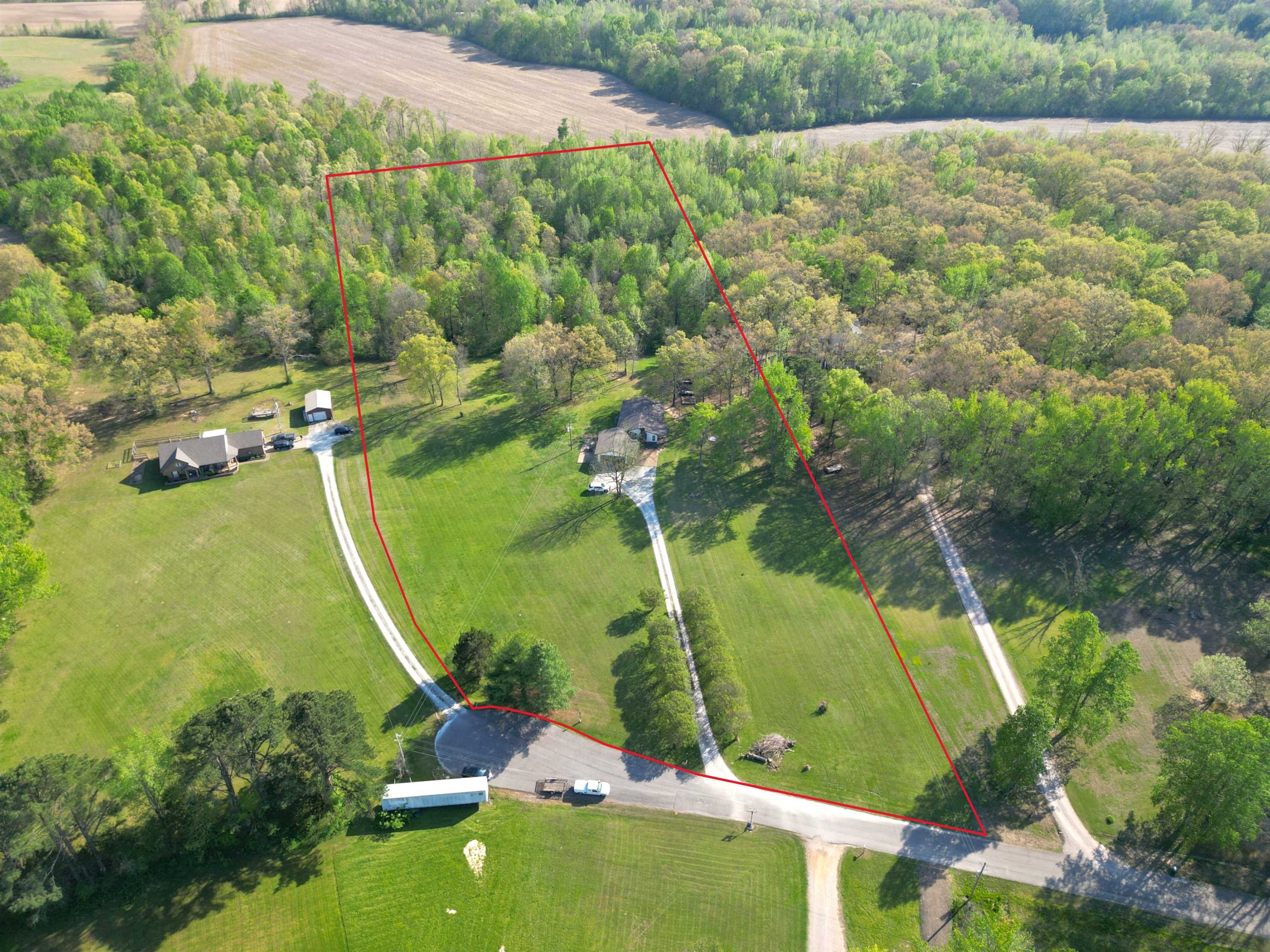 1230 Joann Road Somerville, TN 38068 - Photo 2 of 28 View of rural area featuring property boundaries highlighted and a heavily wooded area