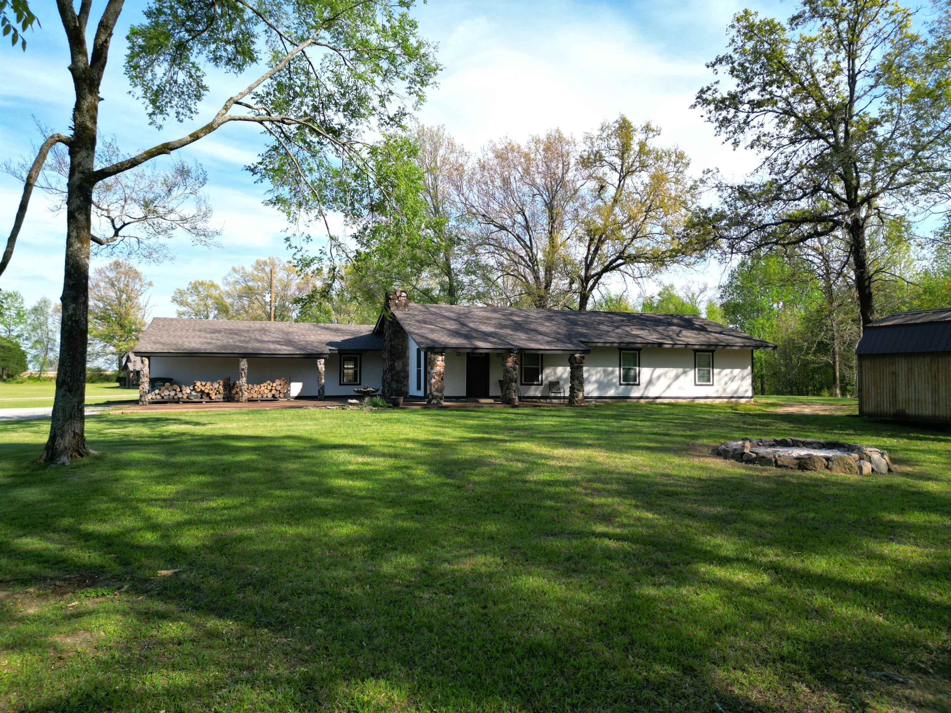 1230 Joann Road Somerville, TN 38068 - Photo 4 of 28 Rear view of property with a lawn, a chimney, an outdoor structure, and a porch