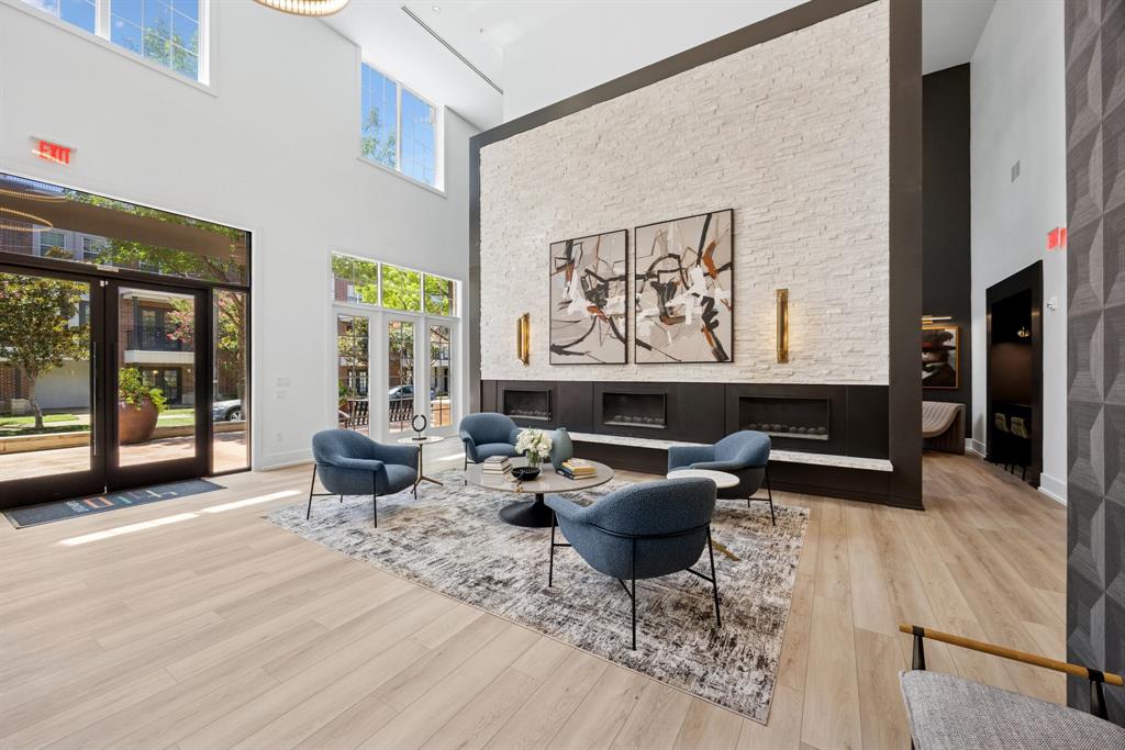 4110 Fairmount Street, Unit 1004 Dallas, TX 75219 - Photo 34 of 35 a living room with furniture and a fireplace