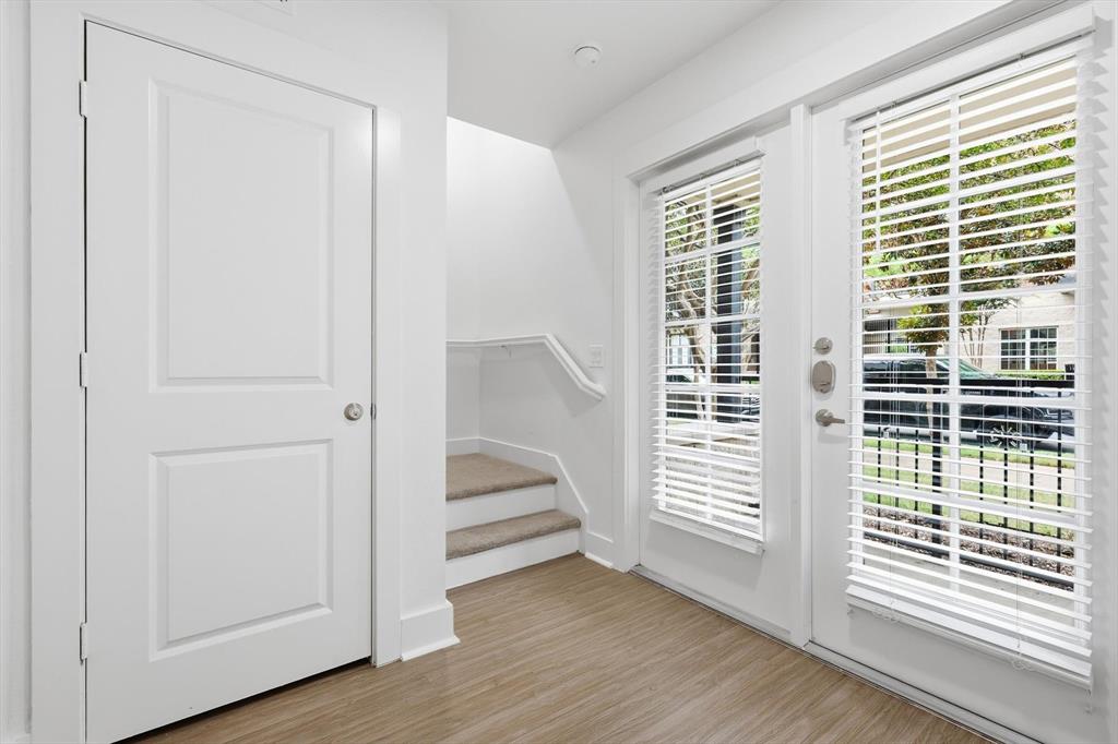 4110 Fairmount Street, Unit 1004 Dallas, TX 75219 - Photo 5 of 35 a view of entryway with wooden floor and windows