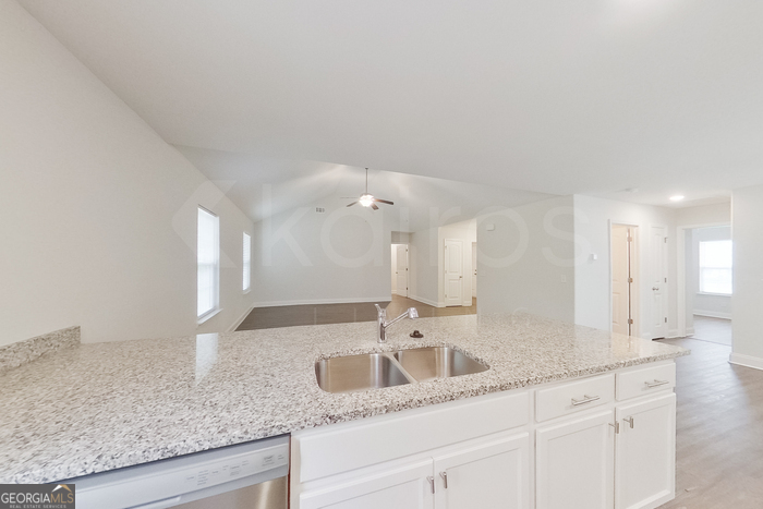 231 Western Red Cedar Drive Springfield, GA 31329 - Photo 9 of 26 a bathroom with double sink and a mirror