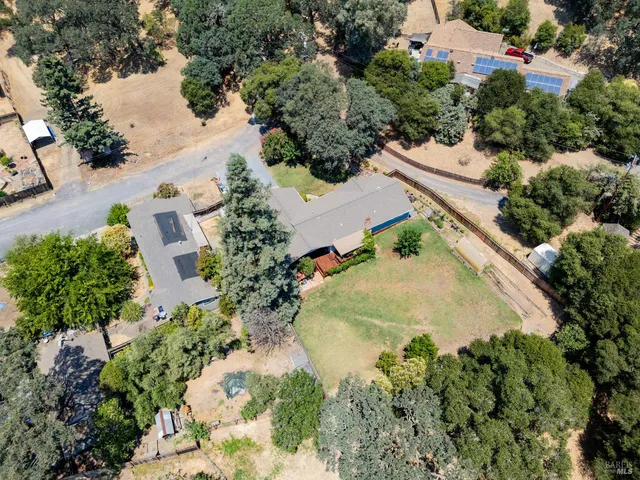 an aerial view of residential house with outdoor space