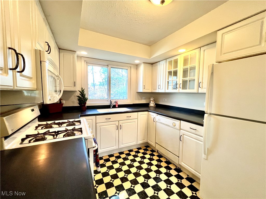 7220 Hemlock Road Independence, OH 44131 - Photo 13 of 48 Beautifully updated kitchen with all appliances and glass door cabs.
