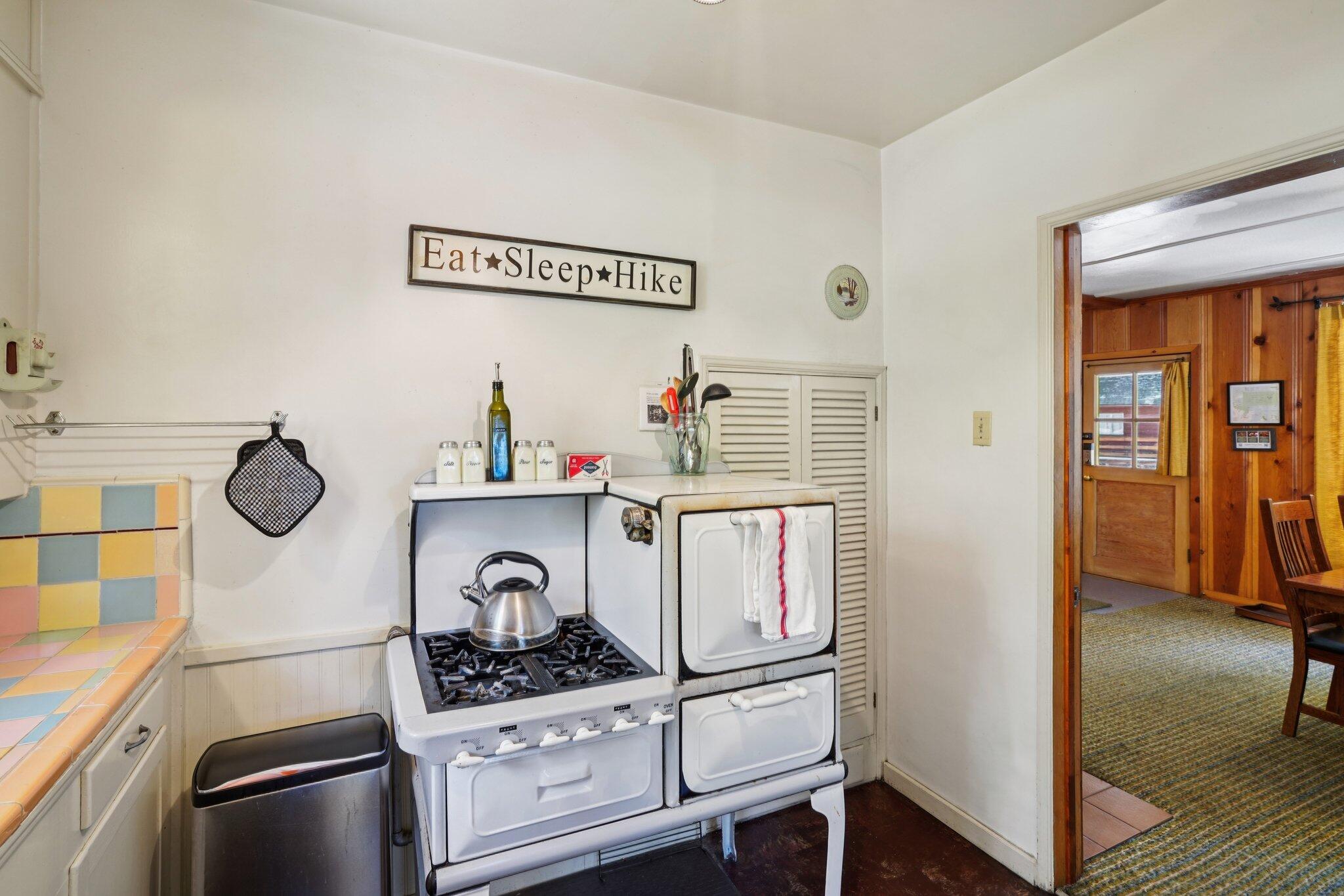 55280 Circle Way Idyllwild, CA 92549 - Photo 13 of 27 a kitchen with a refrigerator and a stove top oven