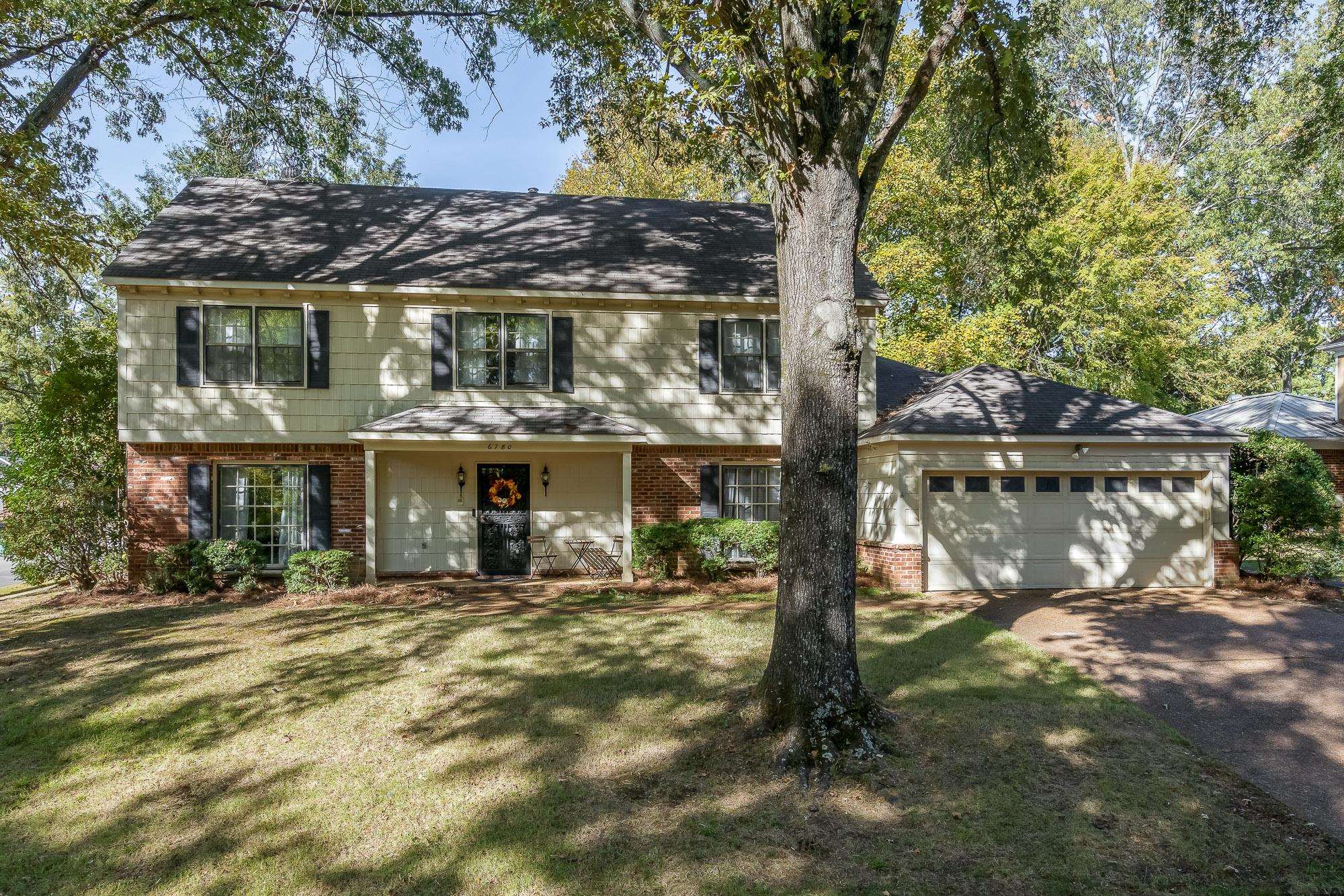 6780 Wytham Drive Memphis, TN 38119 - Photo 1 of 25 a front view of a house with a yard