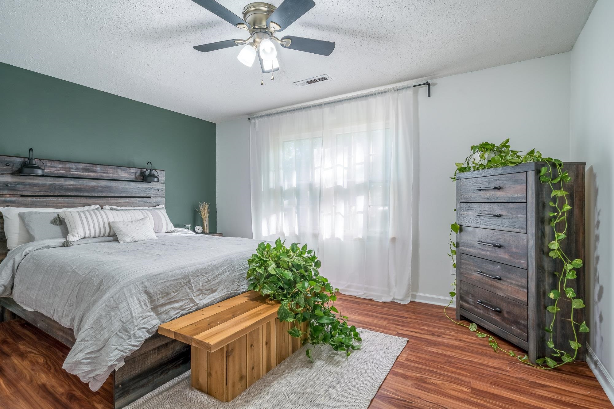 6780 Wytham Drive Memphis, TN 38119 - Photo 19 of 25 a bedroom with a bed and a window