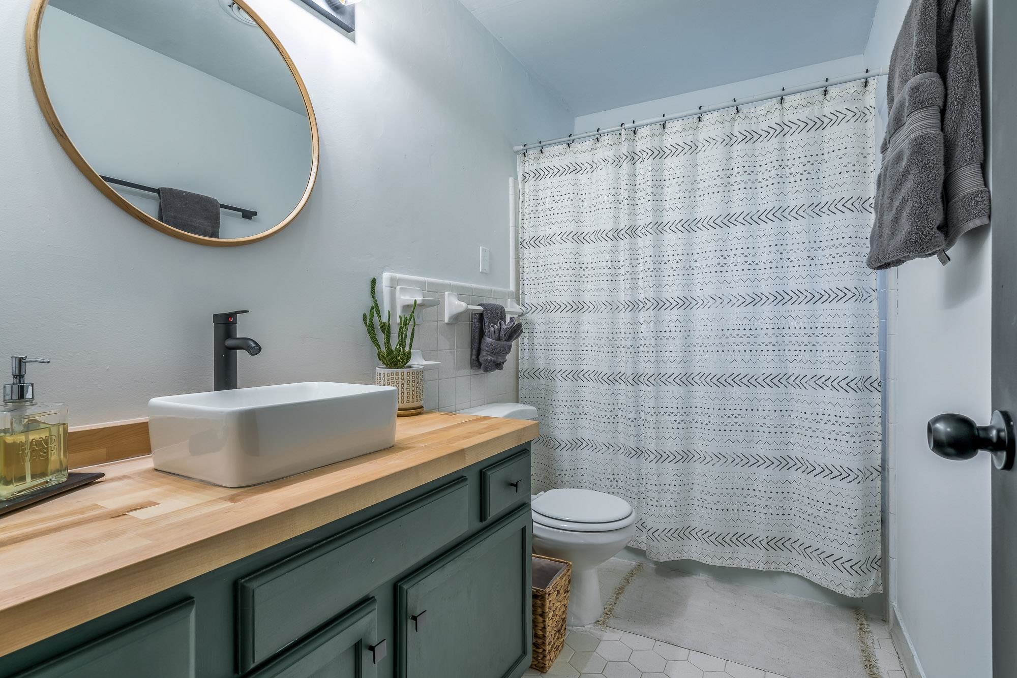 6780 Wytham Drive Memphis, TN 38119 - Photo 20 of 25 a bathroom with a sink a toilet and a mirror