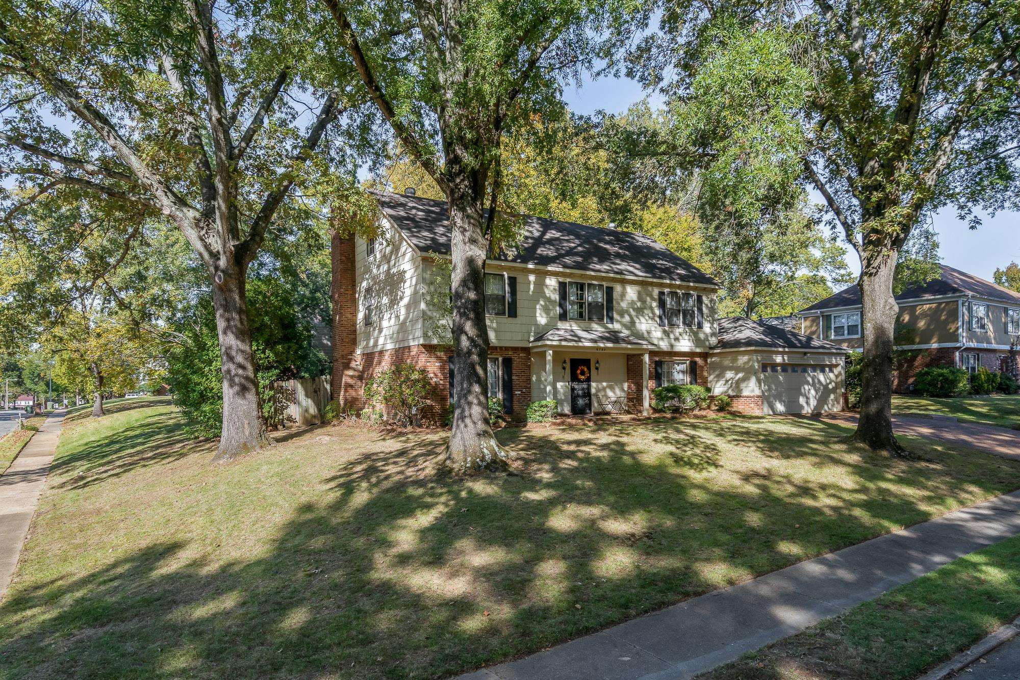 6780 Wytham Drive Memphis, TN 38119 - Photo 2 of 25 a front view of a house with a yard