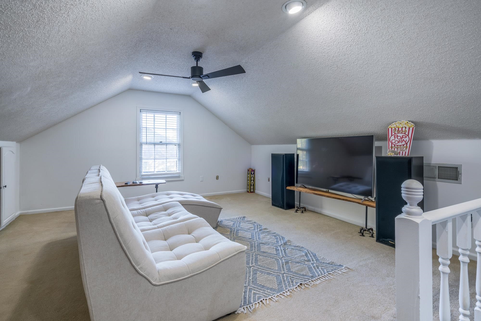 6780 Wytham Drive Memphis, TN 38119 - Photo 22 of 25 a living room with furniture and a flat screen tv
