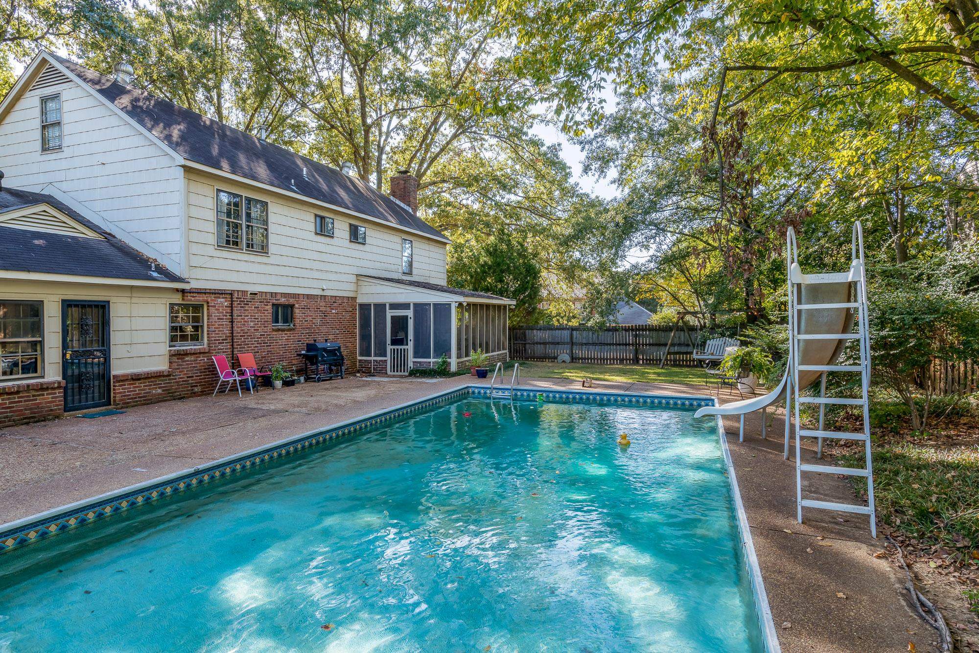 6780 Wytham Drive Memphis, TN 38119 - Photo 25 of 25 a view of a house with swimming pool and a yard