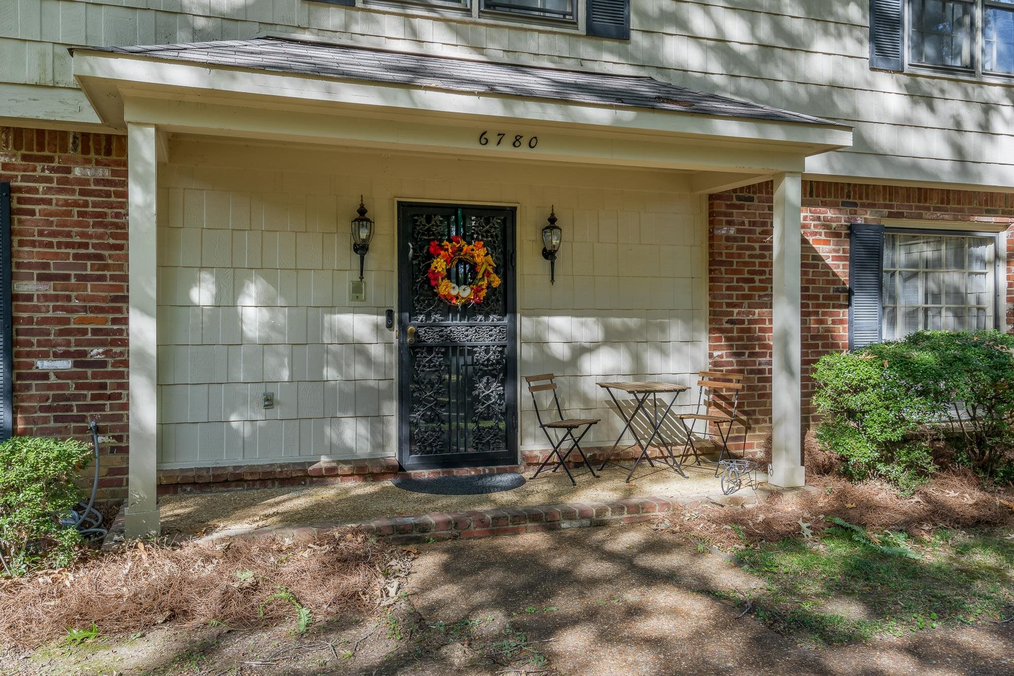 6780 Wytham Drive Memphis, TN 38119 - Photo 4 of 25 a front view of a house with a garage