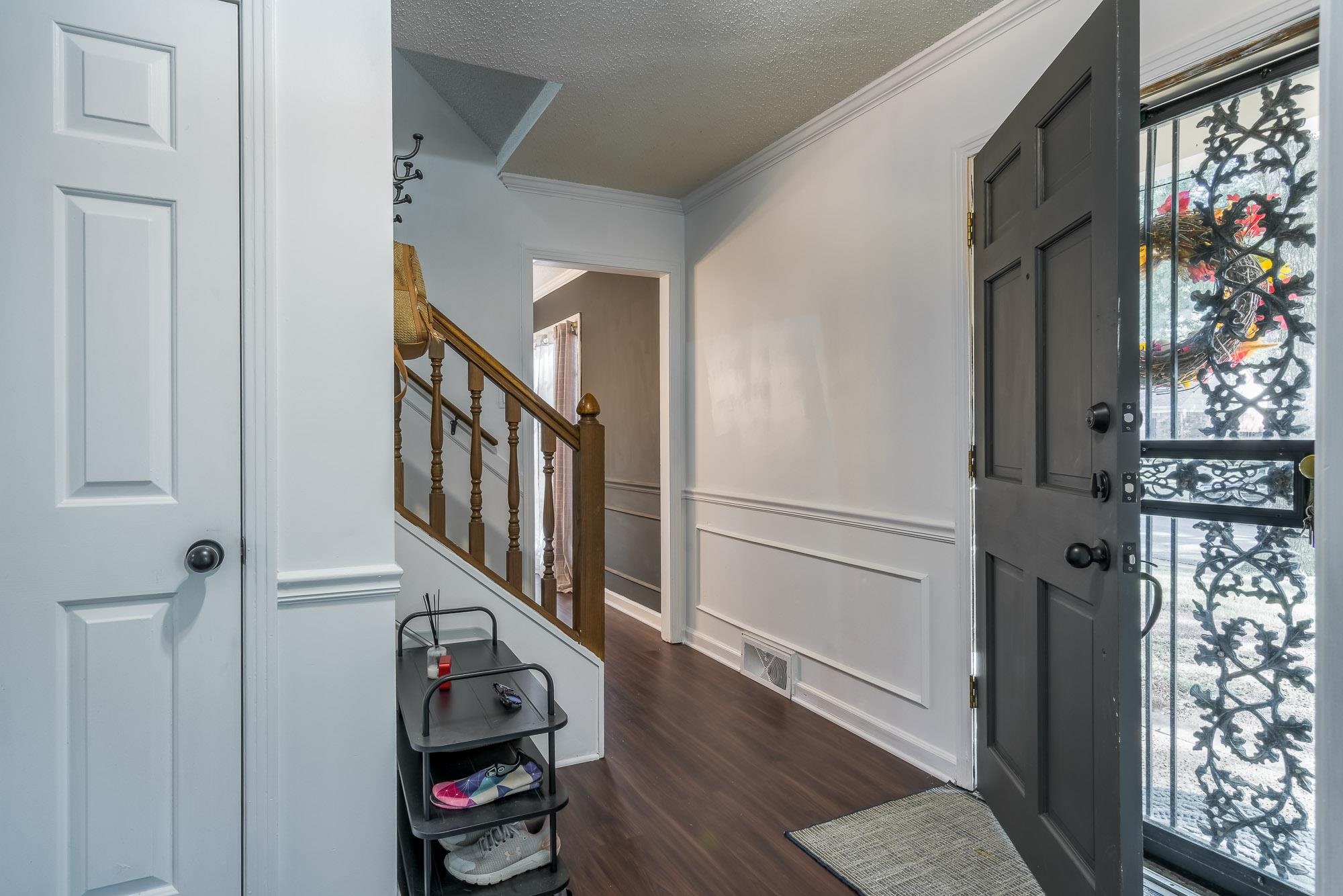 6780 Wytham Drive Memphis, TN 38119 - Photo 5 of 25 a view of entryway with stairs and wooden floor