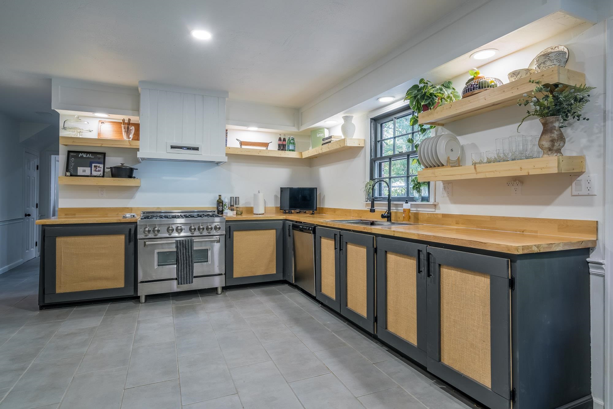 6780 Wytham Drive Memphis, TN 38119 - Photo 9 of 25 a kitchen with stainless steel appliances a white stove top oven a sink and dishwasher