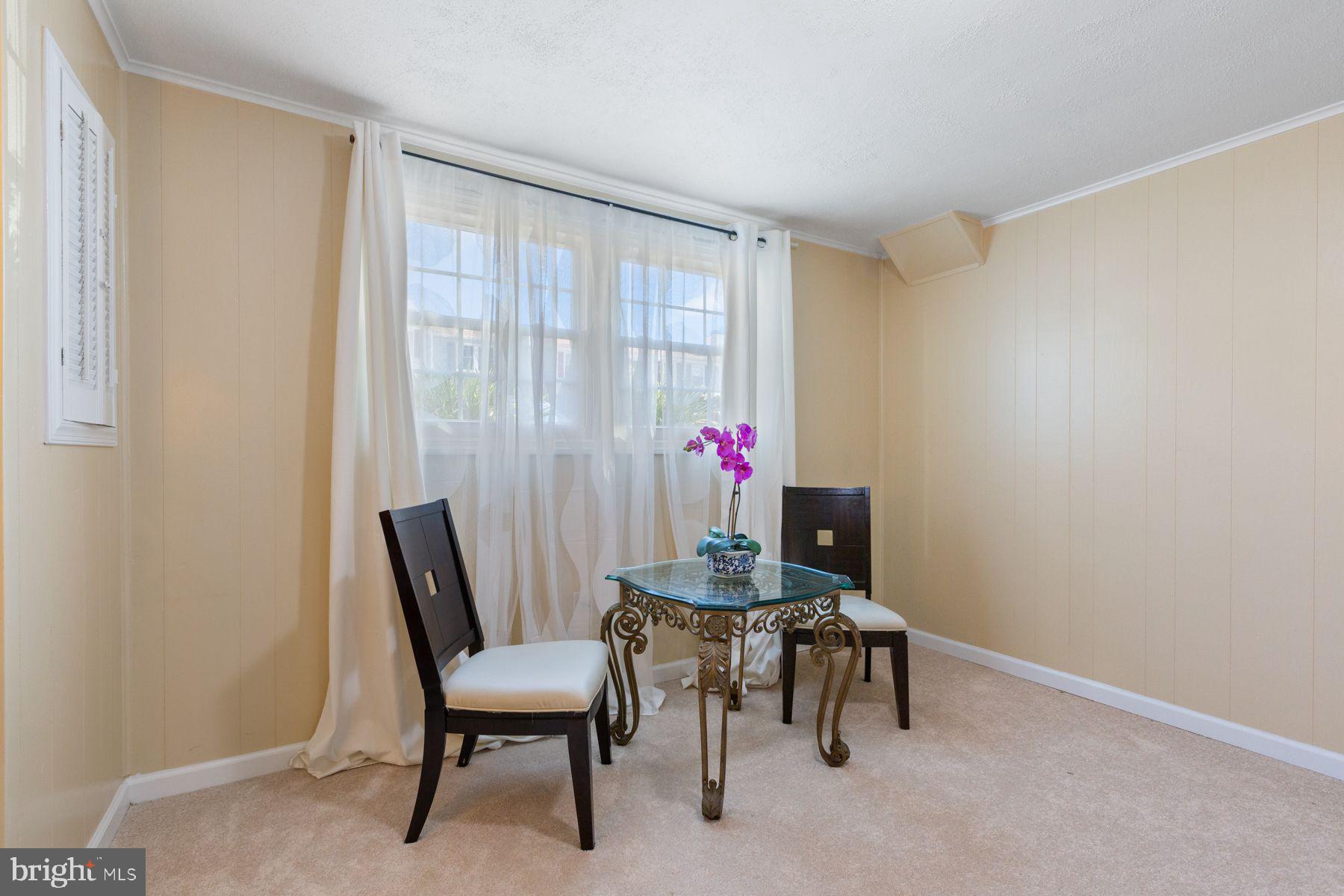 17660 Kohlhoss Road Poolesville, MD 20837 - Photo 18 of 22 a view of a dining room with furniture and a window